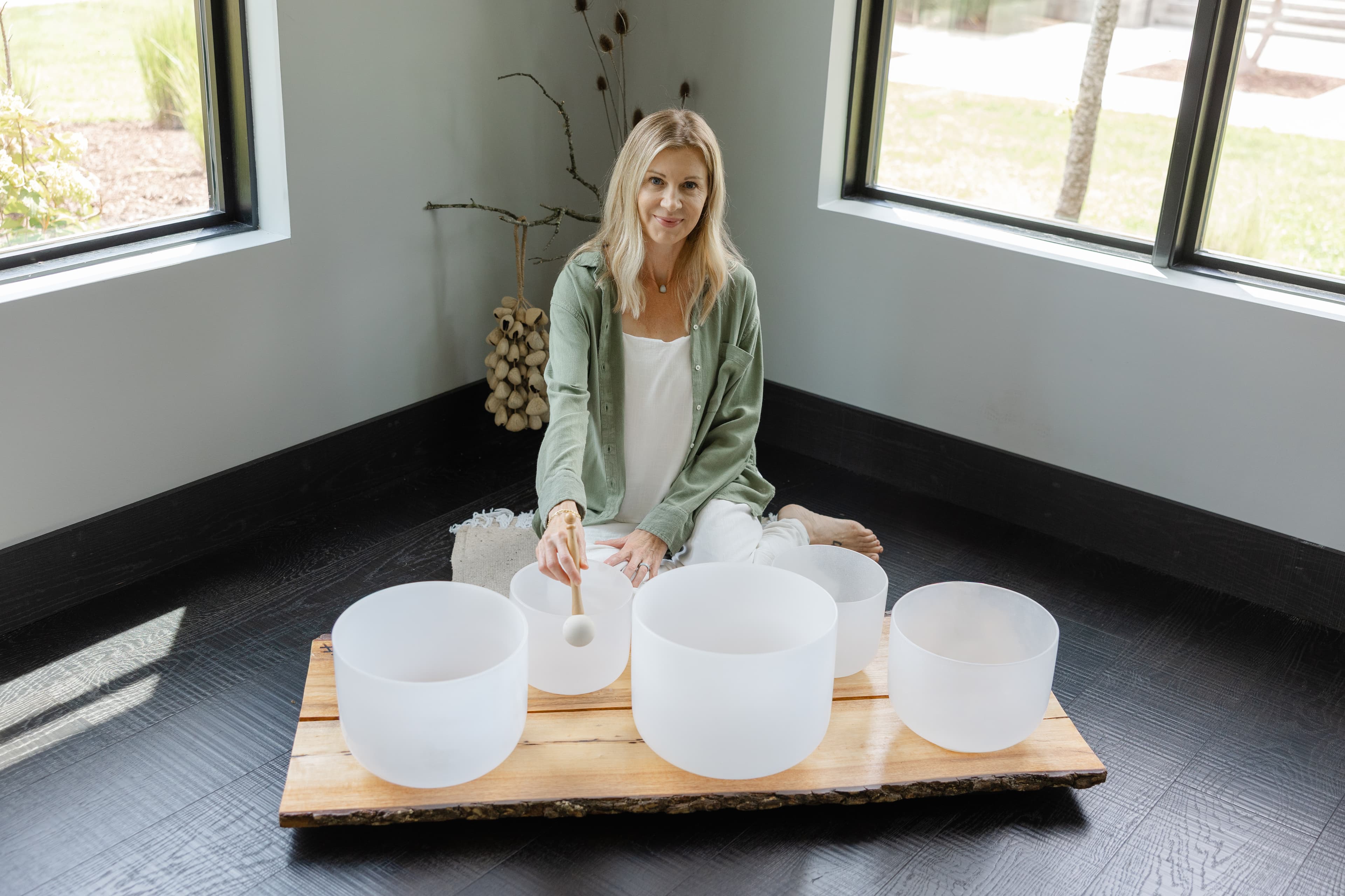Sonja playing crystal singing bowls during a sound bath in Franklin, TN